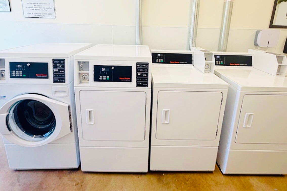 Clean, modern laundry room with washers and dryers at Auburn RV Resort